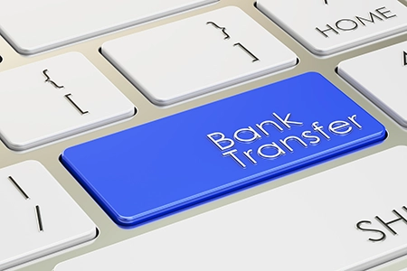 bank transfer button on laptop